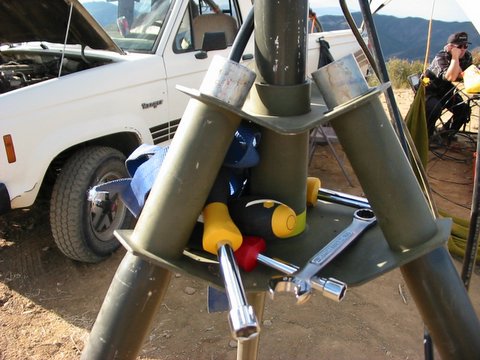 tools in the tripod base of antenna mast