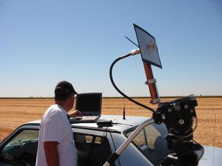 Shayne, N6SPE, checks reception using a home brew flat panel antenna