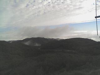 Fog in the valley, clouds above.